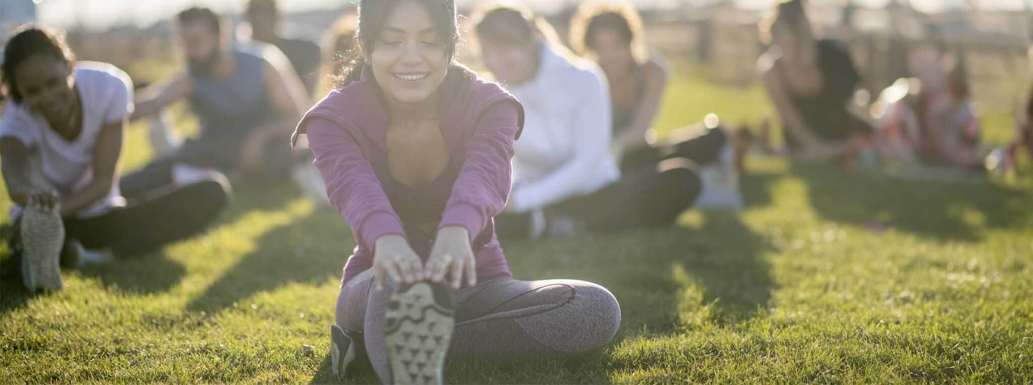 People doing yoga in the park