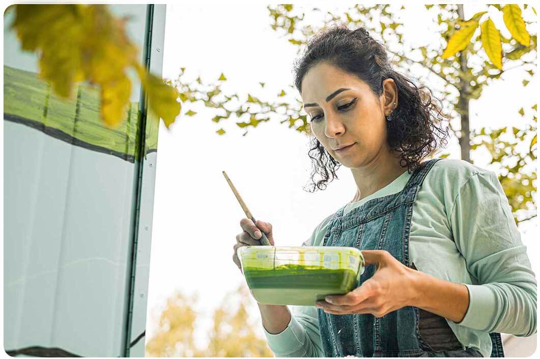 Woman painting door