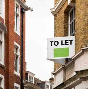 building with to let sign